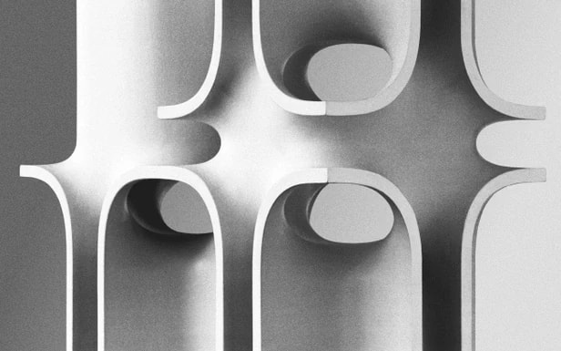 A white façade with rounded forms in relief.